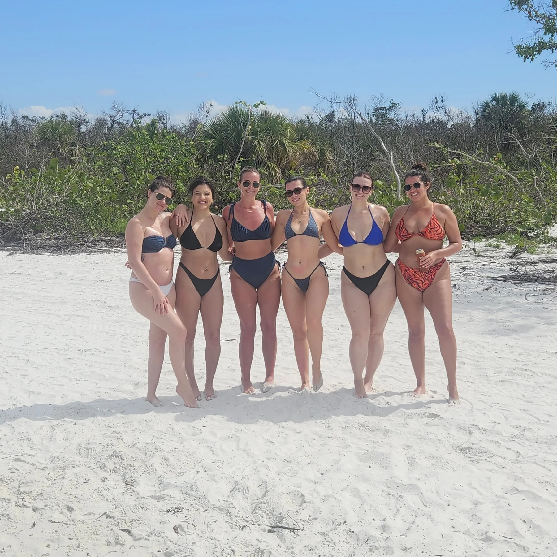 Friends enjoying a beach stop during a Big Tiki Tours island day