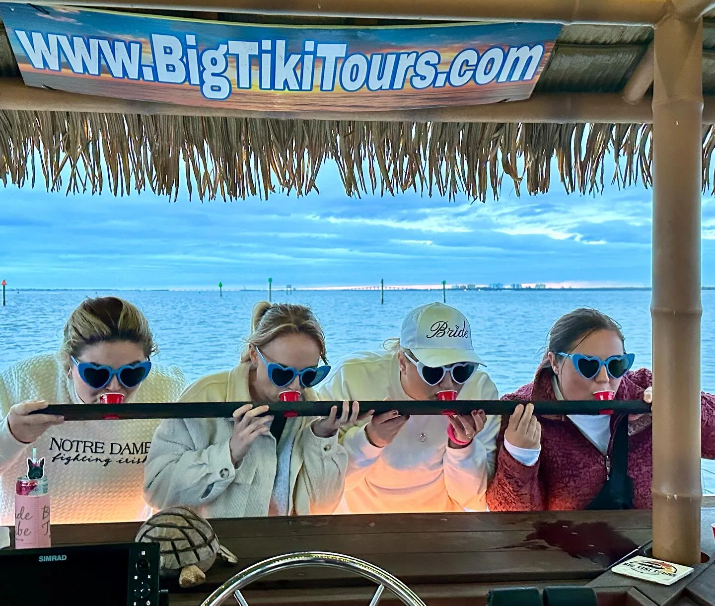 Friends celebrating together aboard Big Tiki Tours