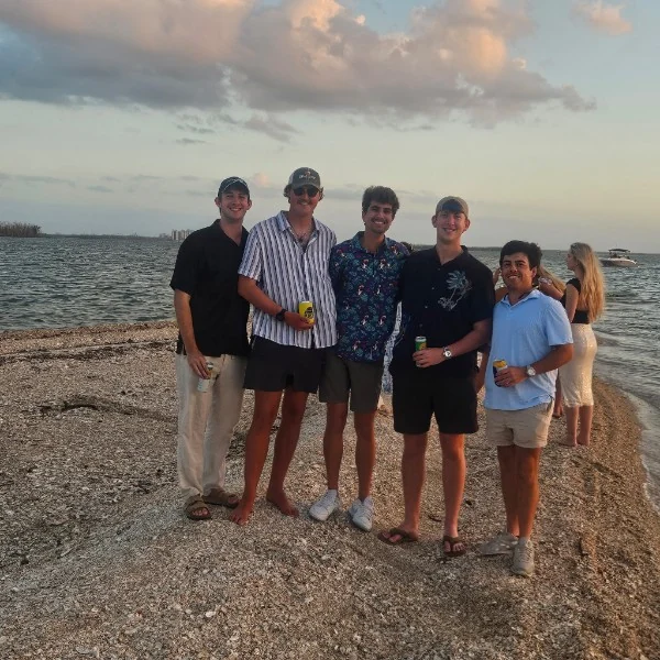 Friends enjoying a beach stop during a private island excursion toward Cayo Costa