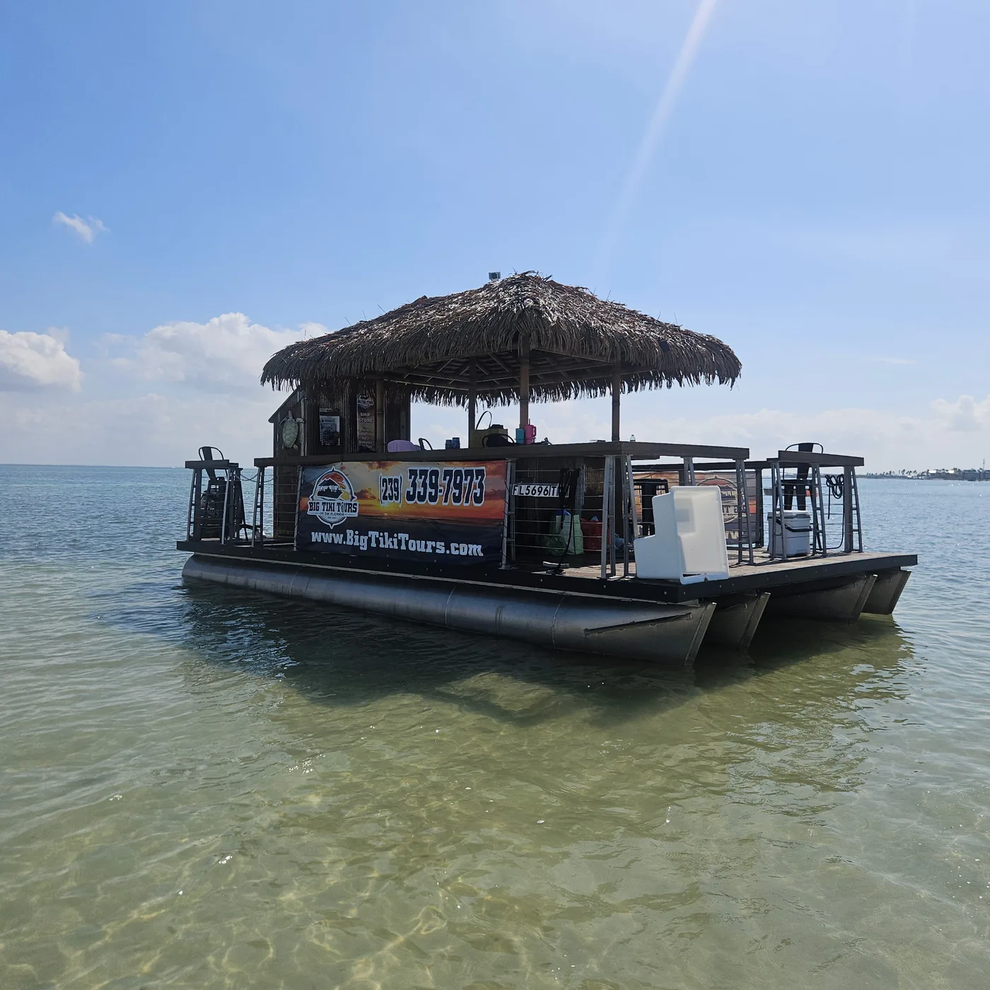 Big Tiki Tours tiki boat in shallow Southwest Florida water