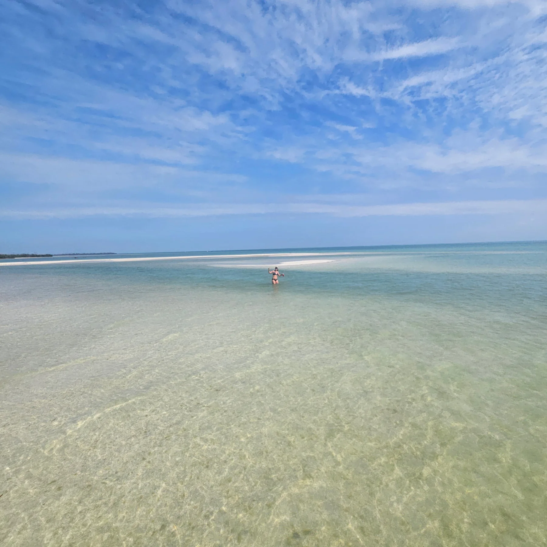 Clear shallow water and sandbar on a Southwest Florida island day