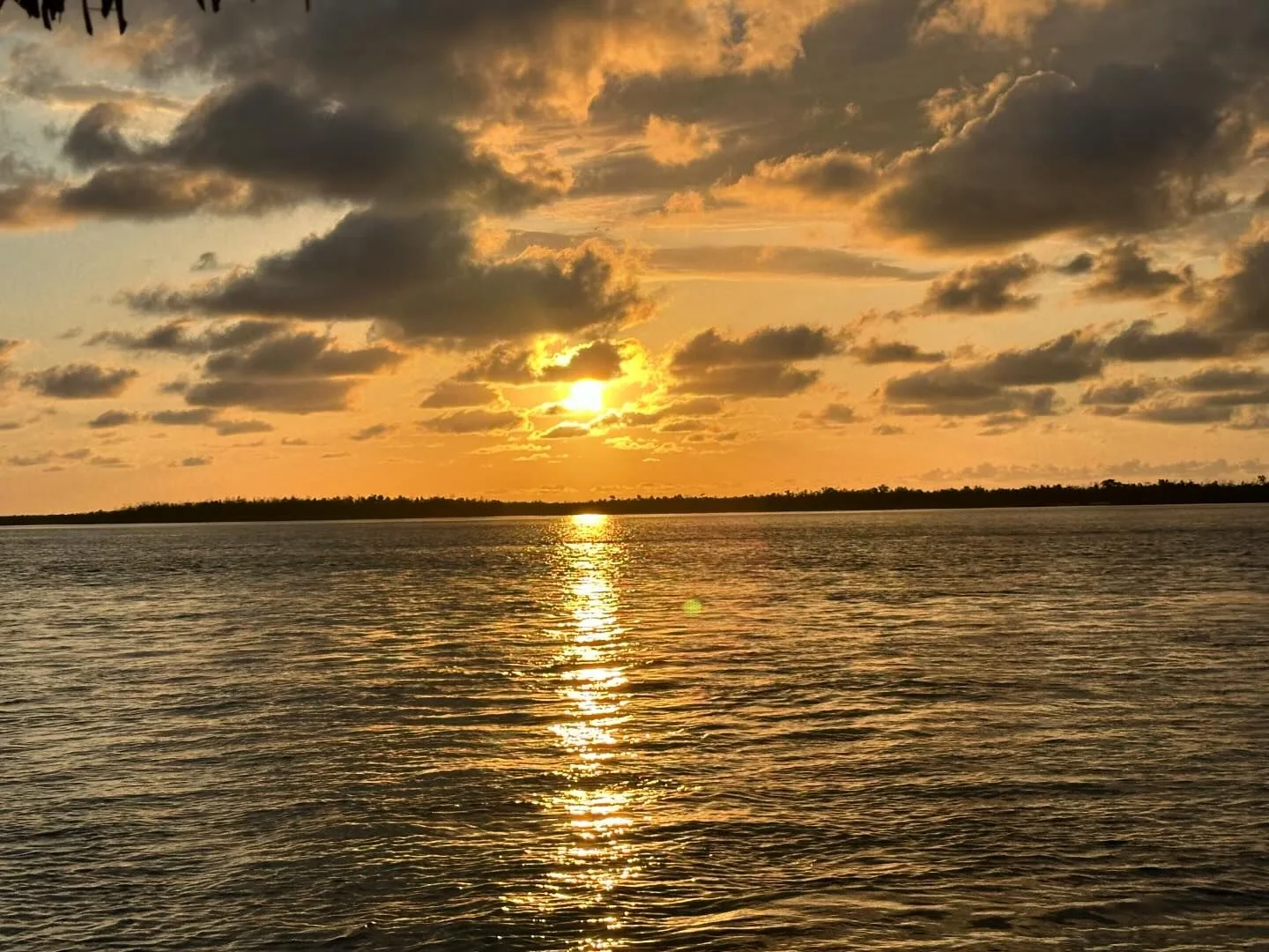 Golden Southwest Florida sunset sky seen from the water