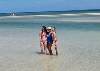 Tiki boat excursion heading toward island beaches