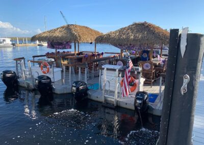 Captain piloting a tiki boat tour in Southwest Florida