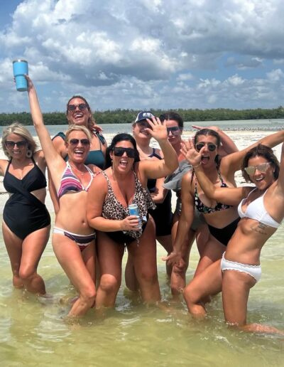 Guests cheering drinks on a tiki boat tour