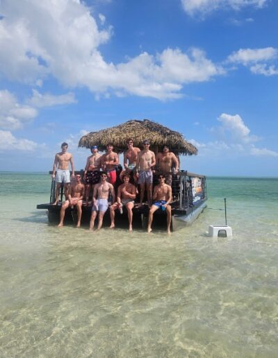 Friend group on a tiki boat charter in Cape Coral