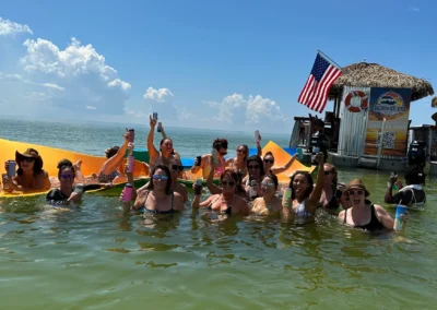 Group celebrating on a private tiki boat charter