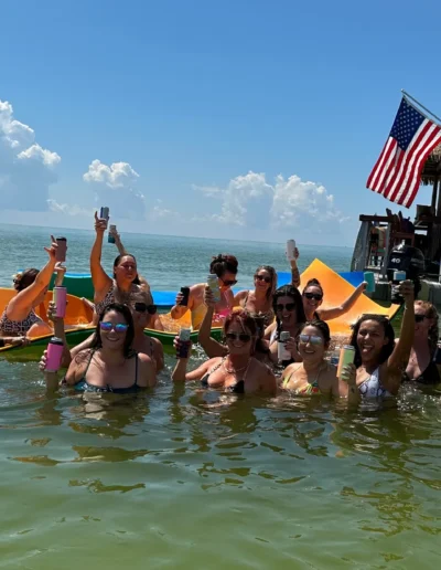 Group celebrating on a private tiki boat charter